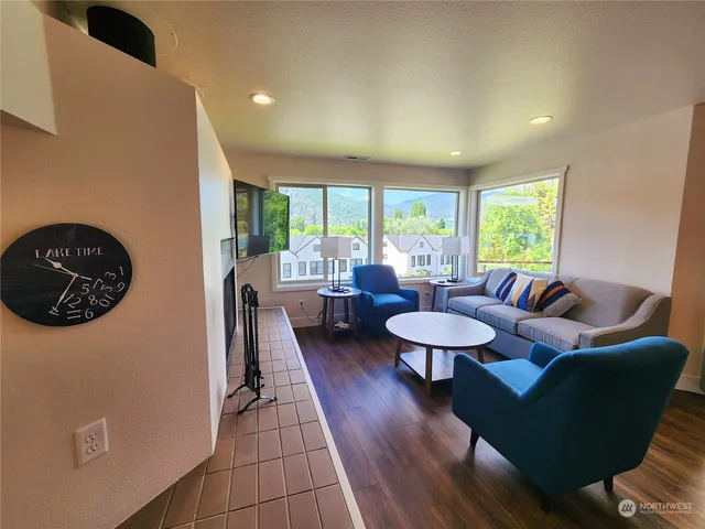 a living room with furniture and a large window
