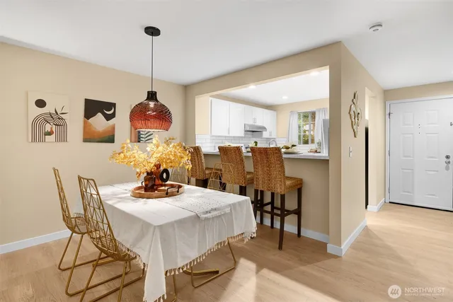 a dining room with furniture and window