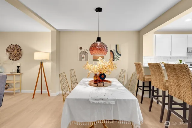 a dining room with furniture and window