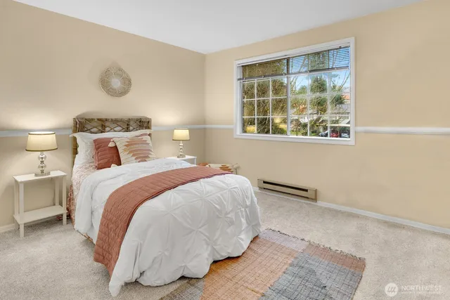 a bedroom with a bed and window