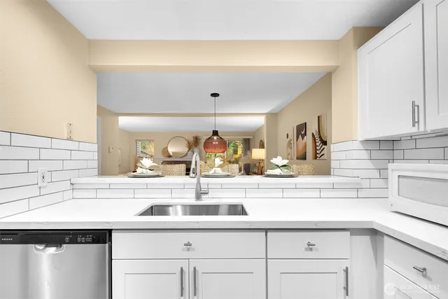 a kitchen with a sink and cabinets