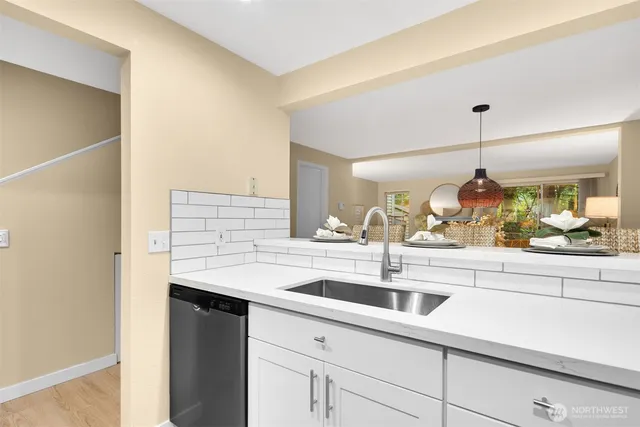 a kitchen with a sink and a window