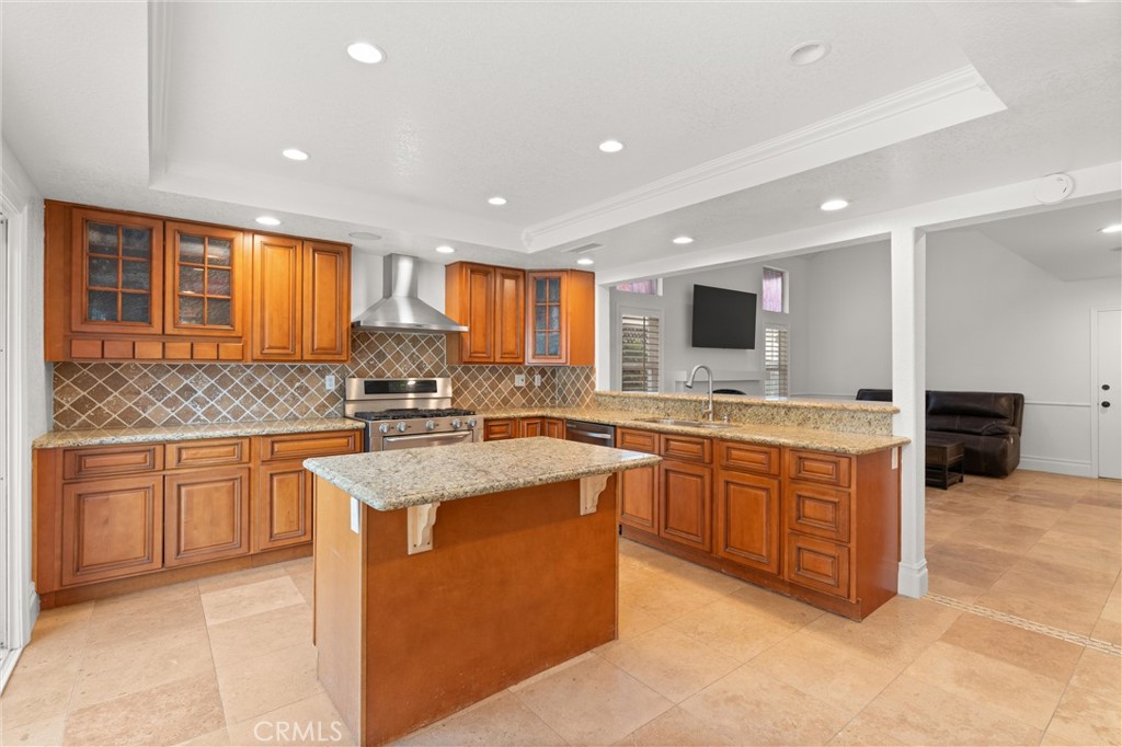 3371 Amy Drive Corona, CA 92882 - Photo 16 of 44 a kitchen with stainless steel appliances granite countertop a sink stove and cabinets