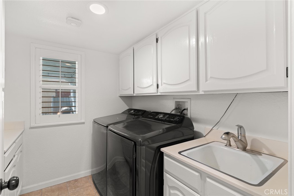3371 Amy Drive Corona, CA 92882 - Photo 18 of 44 a kitchen with a sink and cabinets