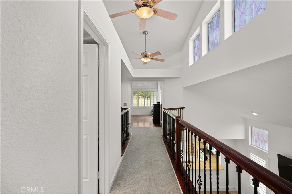 3371 Amy Drive Corona, CA 92882 - Photo 20 of 44 a view of a hallway with a chandelier