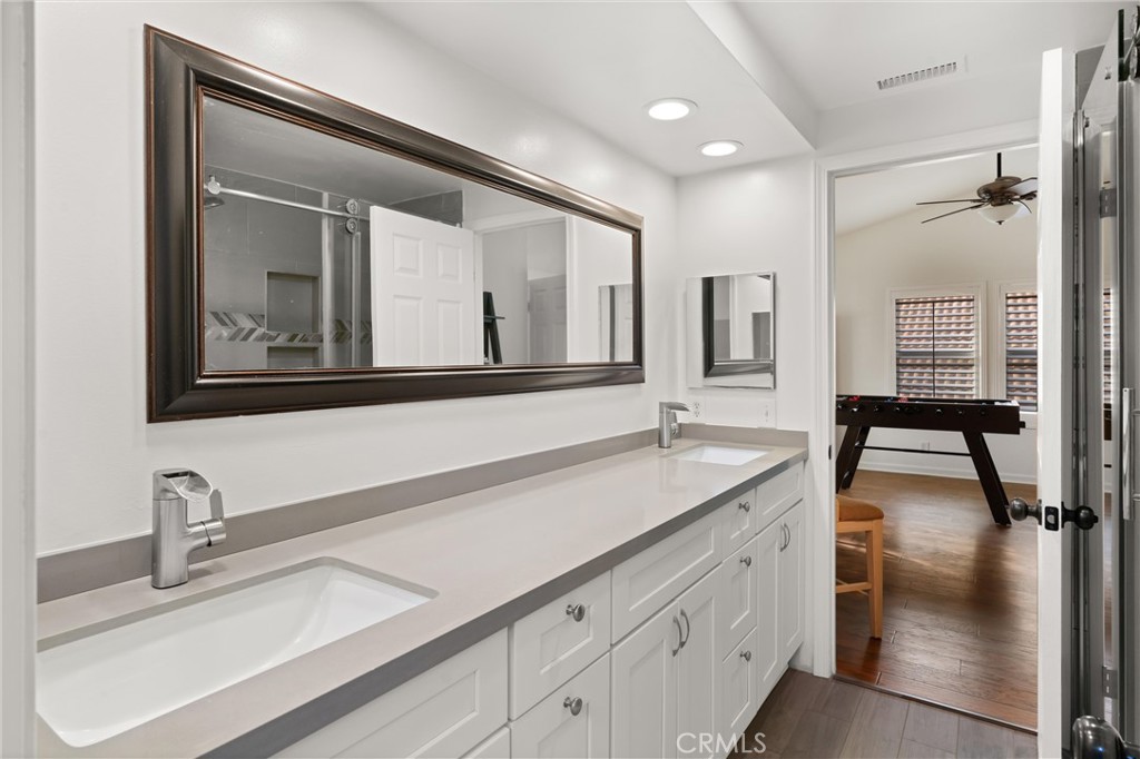3371 Amy Drive Corona, CA 92882 - Photo 23 of 44 a bathroom with a sink and a mirror