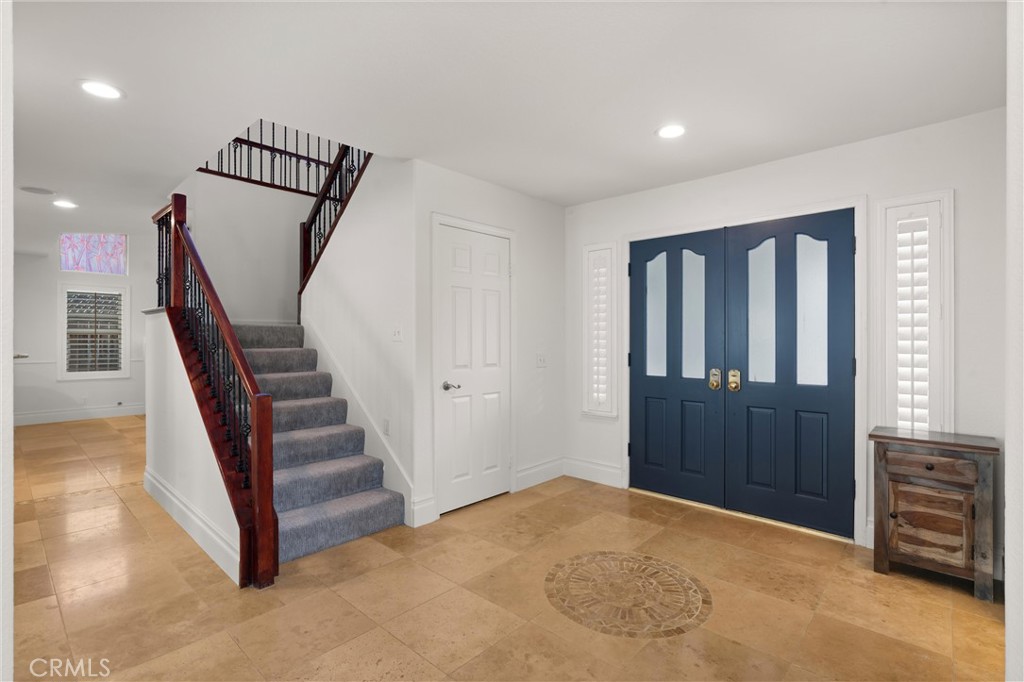 3371 Amy Drive Corona, CA 92882 - Photo 6 of 44 a view of a hallway with entryway wooden floor and staircase