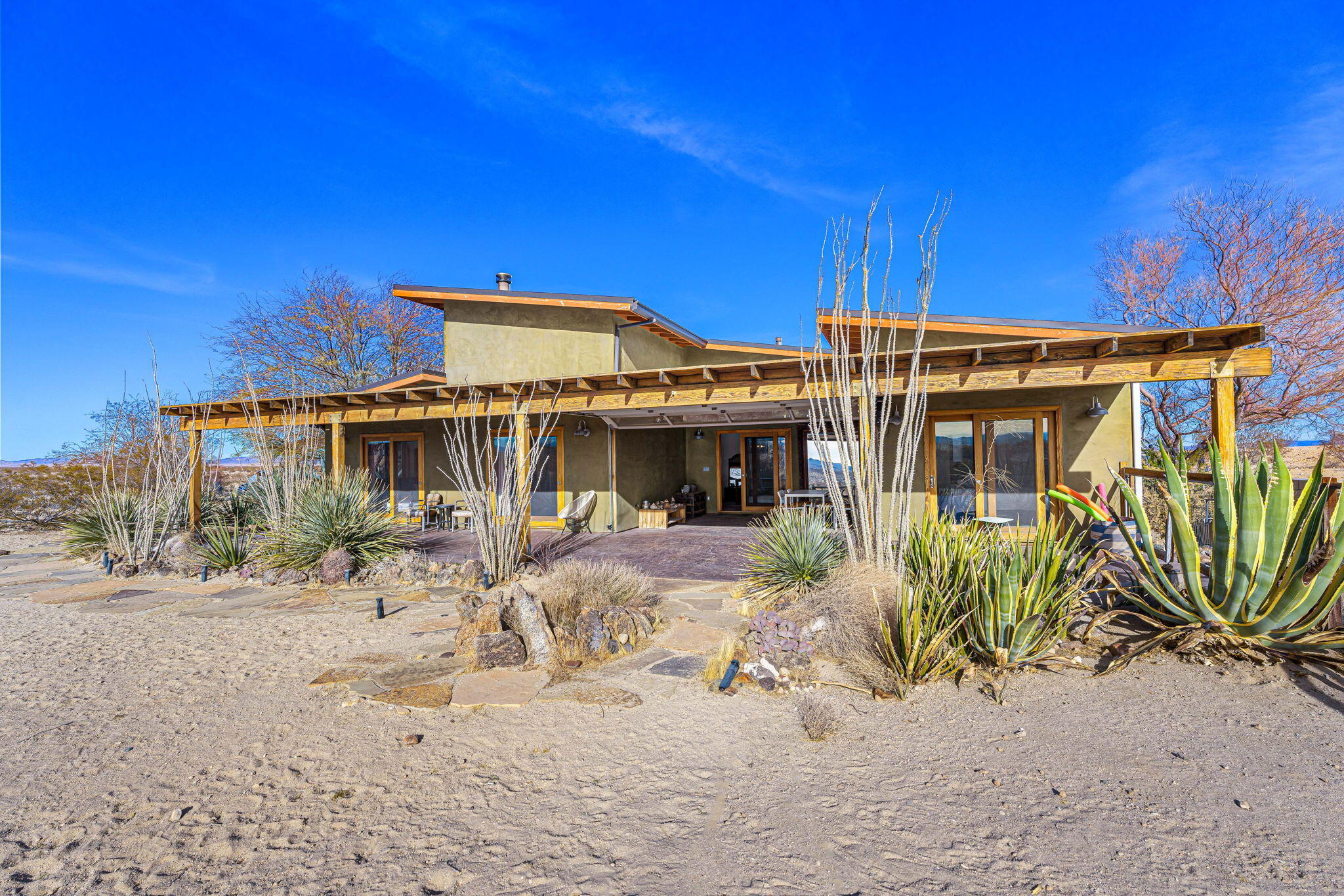 1776 Sunview Avenue Joshua Tree, CA 92252 - Photo 13 of 55 a view of a house with a yard