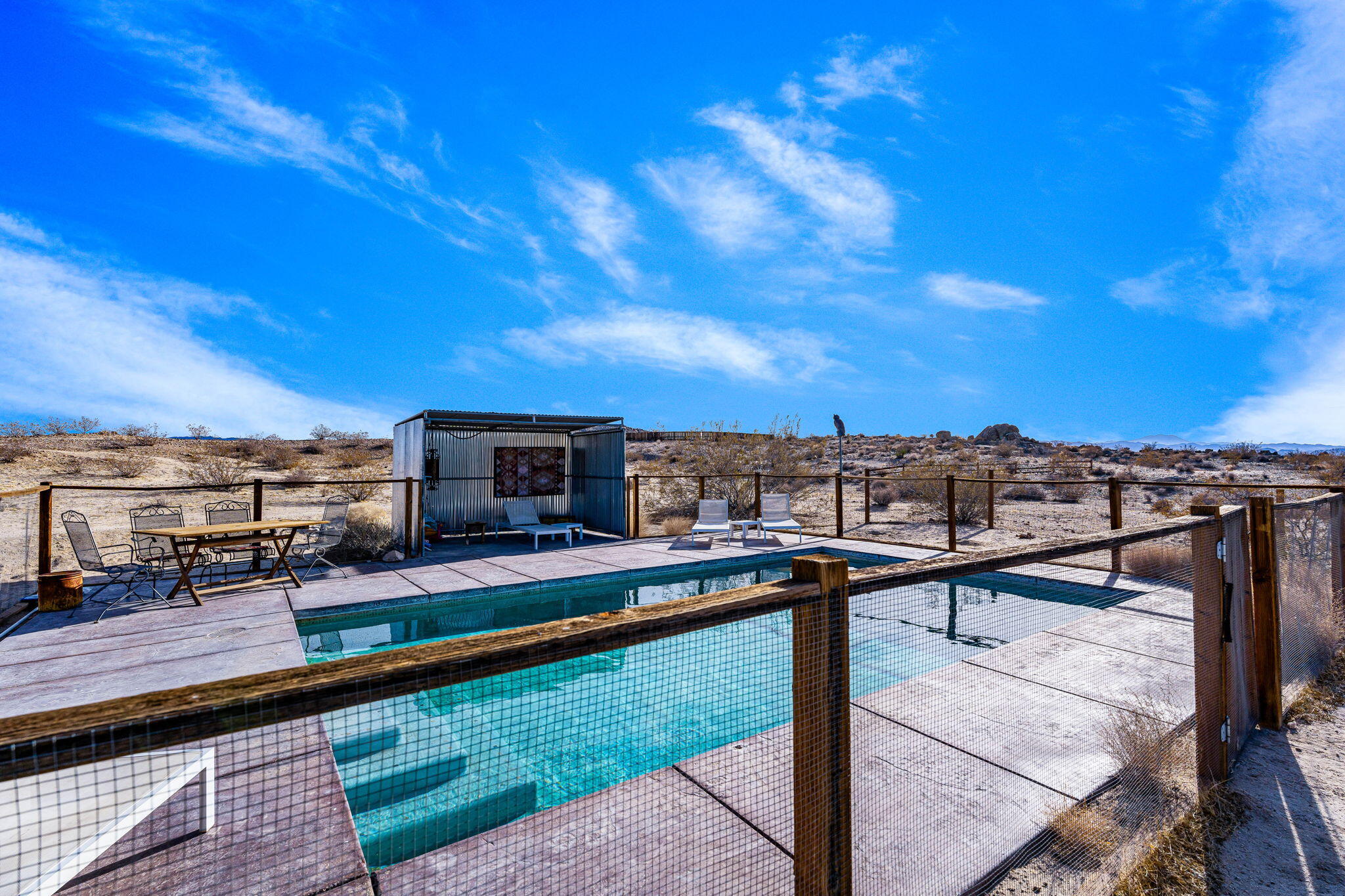 1776 Sunview Avenue Joshua Tree, CA 92252 - Photo 14 of 55 a view of a terrace with sitting area