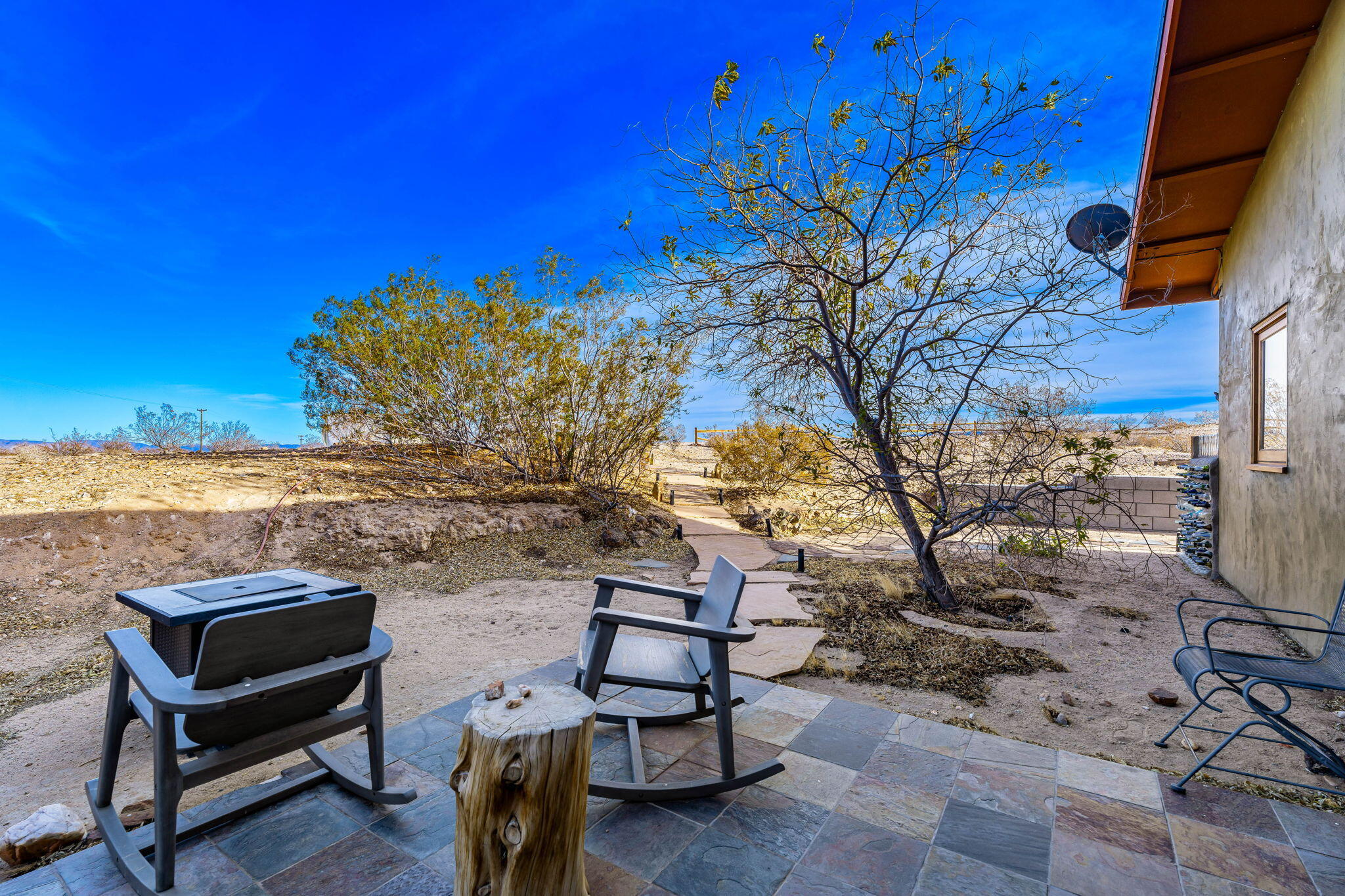 1776 Sunview Avenue Joshua Tree, CA 92252 - Photo 25 of 55 a view of a terrace with chairs
