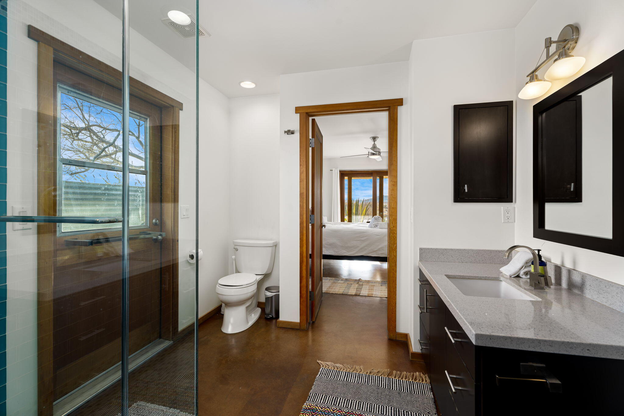 1776 Sunview Avenue Joshua Tree, CA 92252 - Photo 33 of 55 a bathroom with a granite countertop sink a toilet and shower