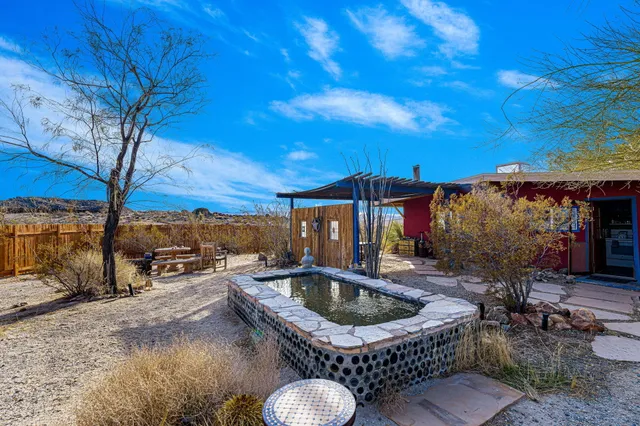 a view of a chairs and table in the patio