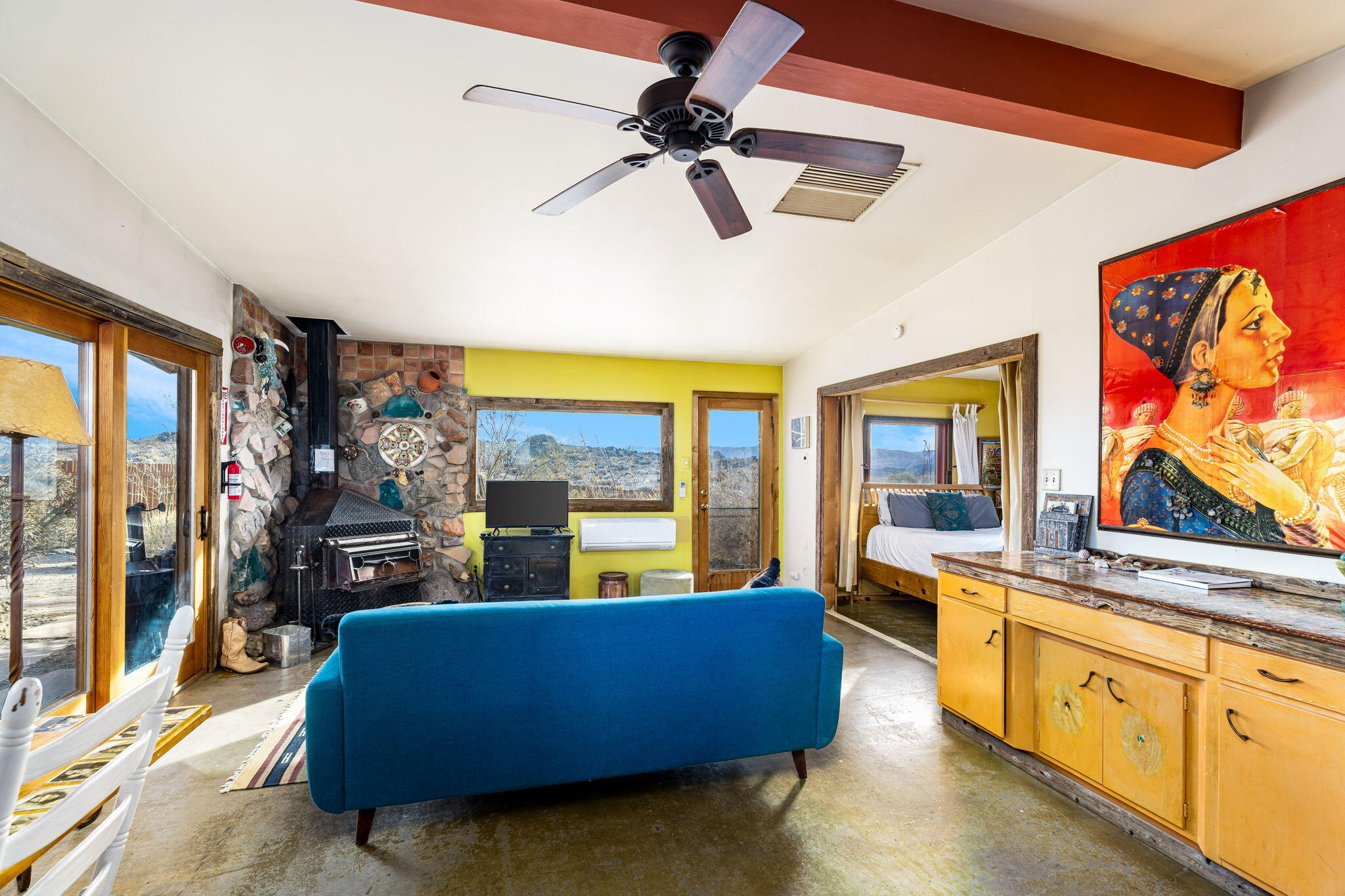 1776 Sunview Avenue Joshua Tree, CA 92252 - Photo 40 of 55 a living room with furniture and a flat screen tv