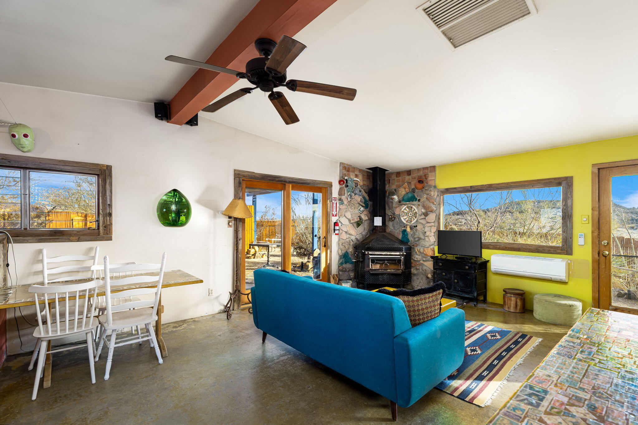 1776 Sunview Avenue Joshua Tree, CA 92252 - Photo 41 of 55 a living room with furniture and a flat screen tv