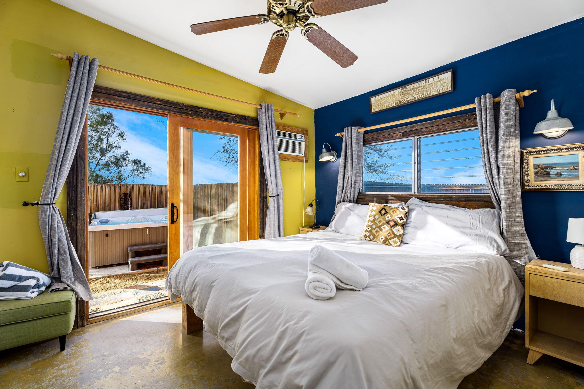 1776 Sunview Avenue Joshua Tree, CA 92252 - Photo 49 of 55 a bedroom with a bed and a chandelier
