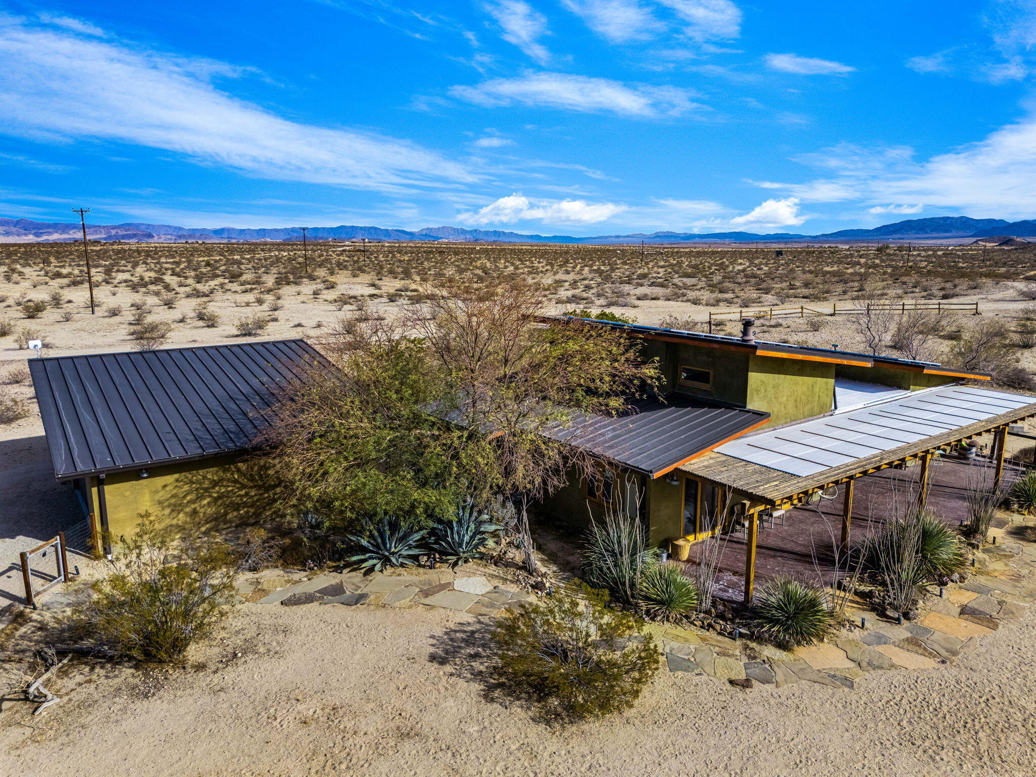1776 Sunview Avenue Joshua Tree, CA 92252 - Photo 5 of 55 a view of a terrace with a garden
