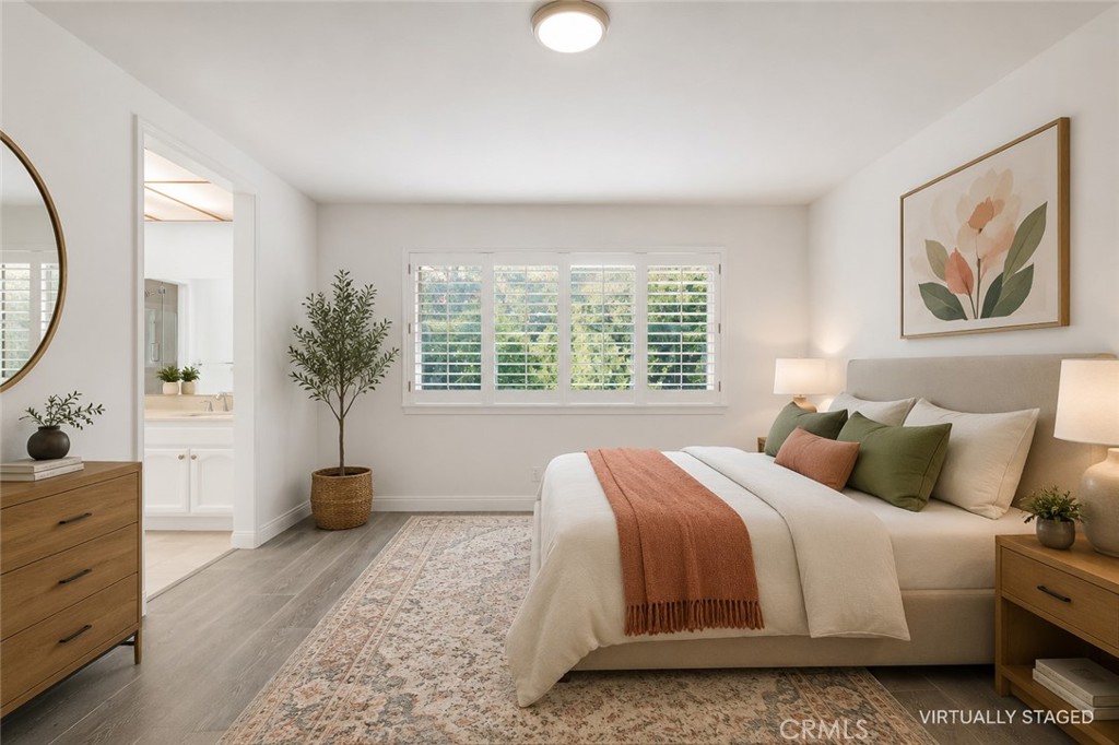 19451 Eagle Ridge Lane Porter Ranch, CA 91326 - Photo 35 of 59 a bedroom with bed and a large mirror next to a window