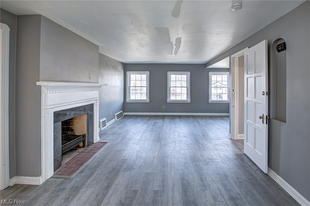 3423 Westbury Road Cleveland, OH 44120 - Photo 24 of 38 Unfurnished living room featuring dark hardwood / wood-style floors and a healthy amount of sunlight
