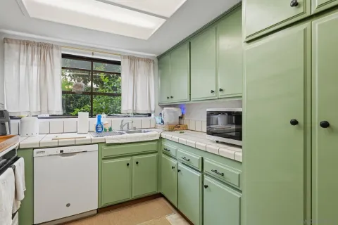 a room that has a sink and a chair in it