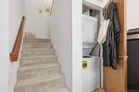 a bedroom with bed and a flat tv screen