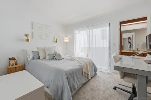 a bedroom with a bed and a couch