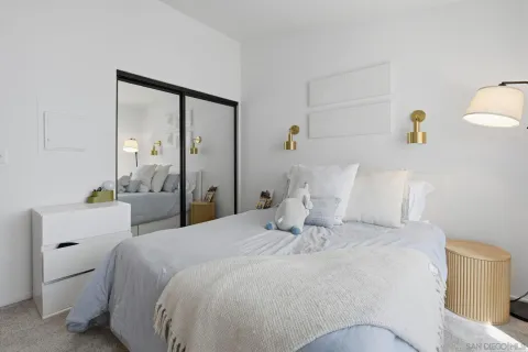 a bathroom with a double vanity sink and a mirror