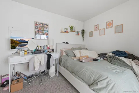 a bedroom with furniture and a window
