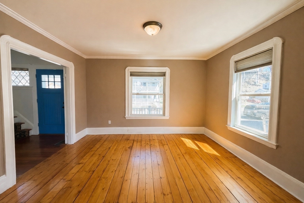 481 Humphrey Street Swampscott, MA 01907 - Photo 13 of 28 an empty room with wooden floor and windows