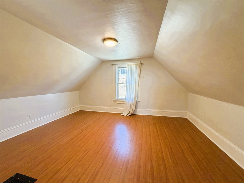 481 Humphrey Street Swampscott, MA 01907 - Photo 19 of 28 an empty room with wooden floor and windows