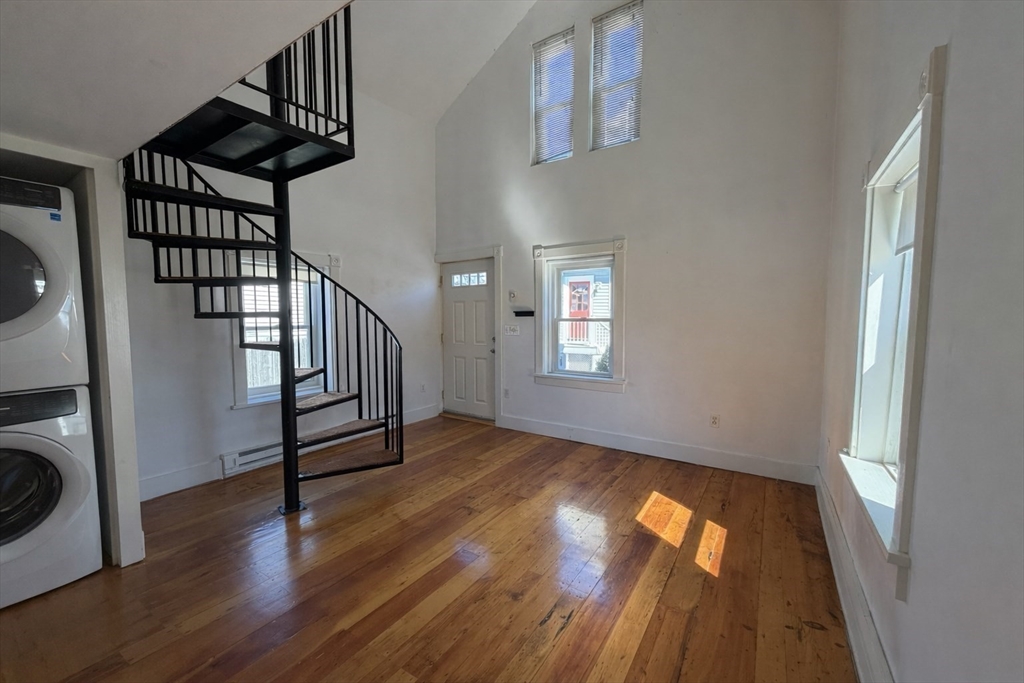 481 Humphrey Street Swampscott, MA 01907 - Photo 21 of 28 a view of entryway with wooden floor and stairs