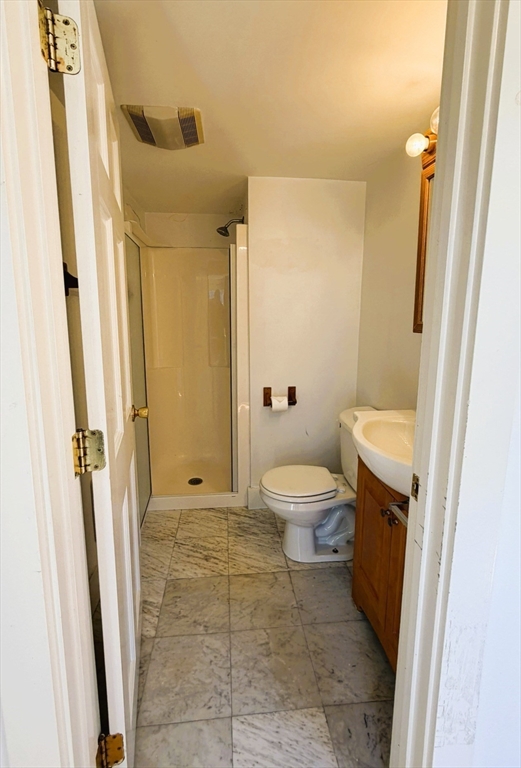 481 Humphrey Street Swampscott, MA 01907 - Photo 23 of 28 a bathroom with a toilet and a shower