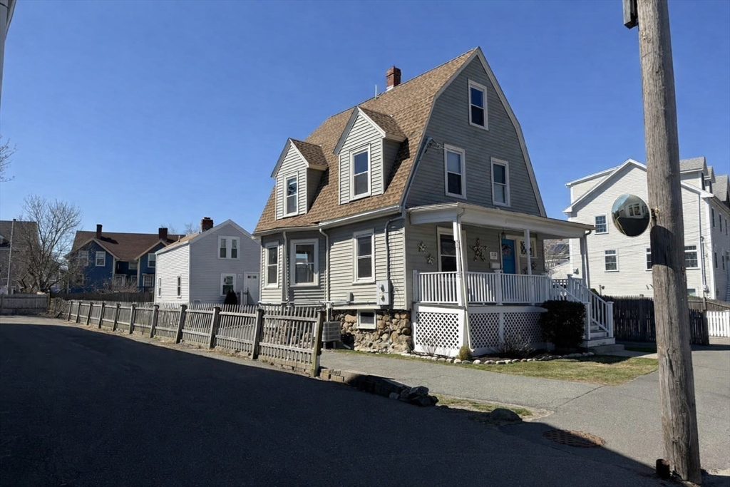 481 Humphrey Street Swampscott, MA 01907 - Photo 3 of 28 a front view of a house with a porch