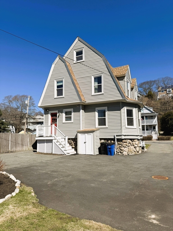 481 Humphrey Street Swampscott, MA 01907 - Photo 4 of 28 a front view of a house with a patio