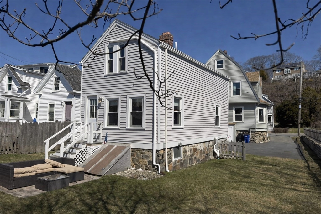 481 Humphrey Street Swampscott, MA 01907 - Photo 5 of 28 a front view of a house with garden