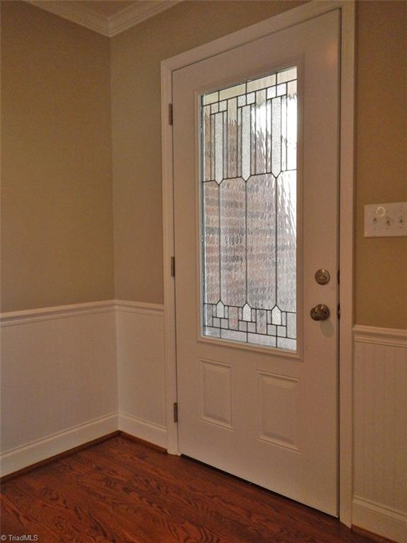 8007 Eastridge Road Oak Ridge, NC 27310 - Photo 2 of 29 The front door has a leaded glass window.