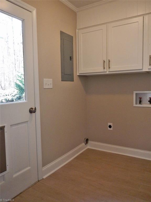8007 Eastridge Road Oak Ridge, NC 27310 - Photo 11 of 29 The Laundry Room is located just off the kitchen. It has lots of storage space & a windowed door opens to the deck.
