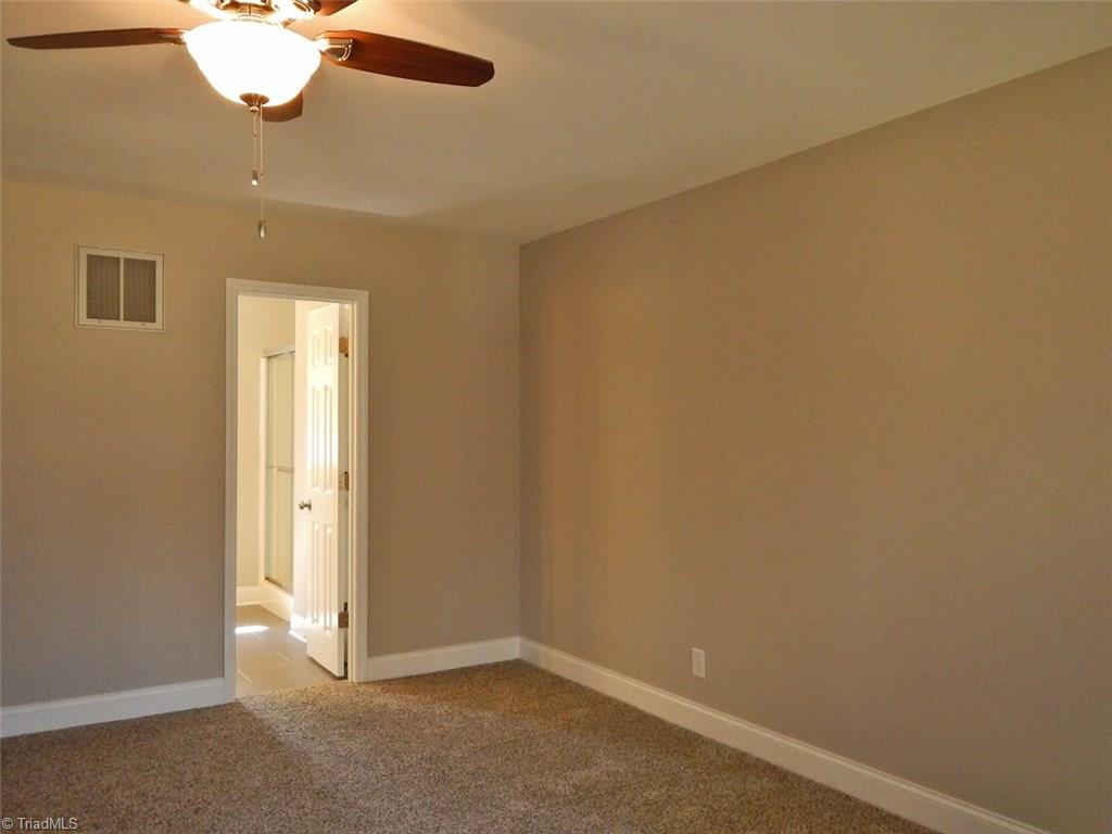 8007 Eastridge Road Oak Ridge, NC 27310 - Photo 16 of 29 Master Bedroom to Master Bathroom