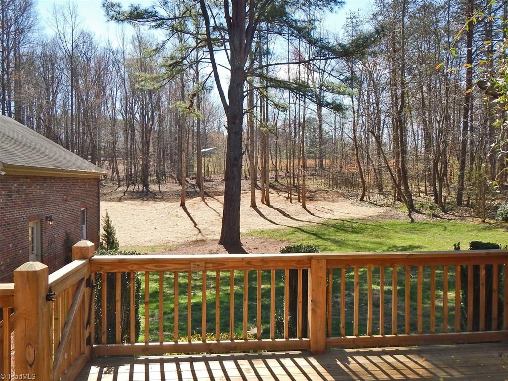 8007 Eastridge Road Oak Ridge, NC 27310 - Photo 24 of 29 The Deck provides views of the wooded back yard.