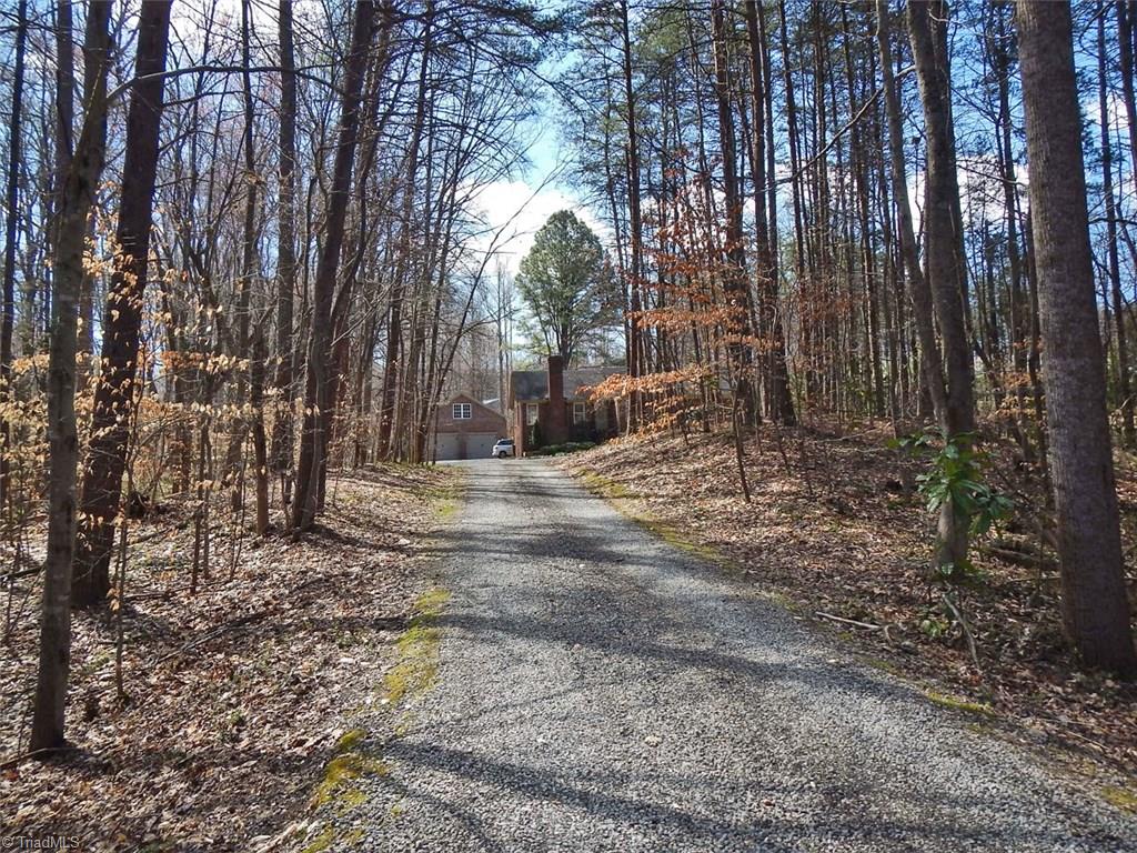 8007 Eastridge Road Oak Ridge, NC 27310 - Photo 29 of 29 The house is nestled in the middle of a deep 2.15acre wooded lot.