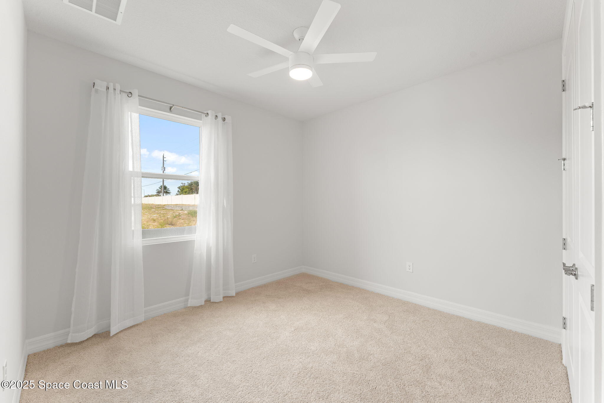 225 1st Street Cocoa, FL 32922 - Photo 18 of 64 an empty room with a bathroom