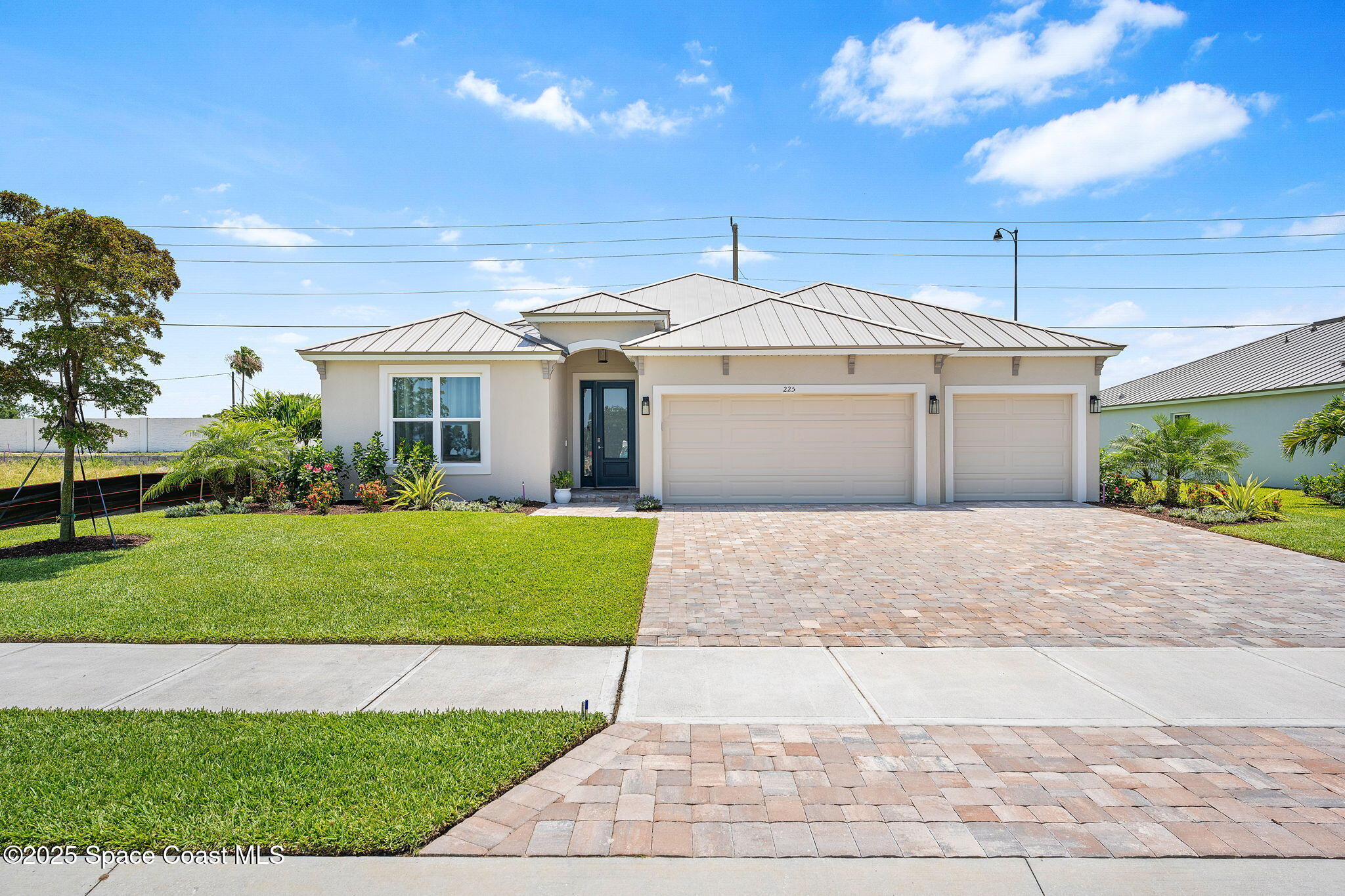 225 1st Street Cocoa, FL 32922 - Photo 2 of 64 a front view of a house with a garden and plants