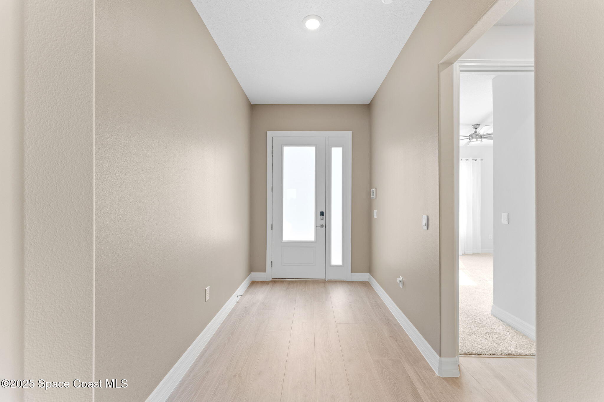 225 1st Street Cocoa, FL 32922 - Photo 23 of 64 a view of a hallway with wooden floor