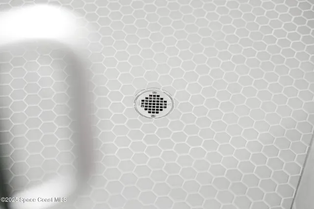 a bathroom with a double vanity sink a mirror and a shower