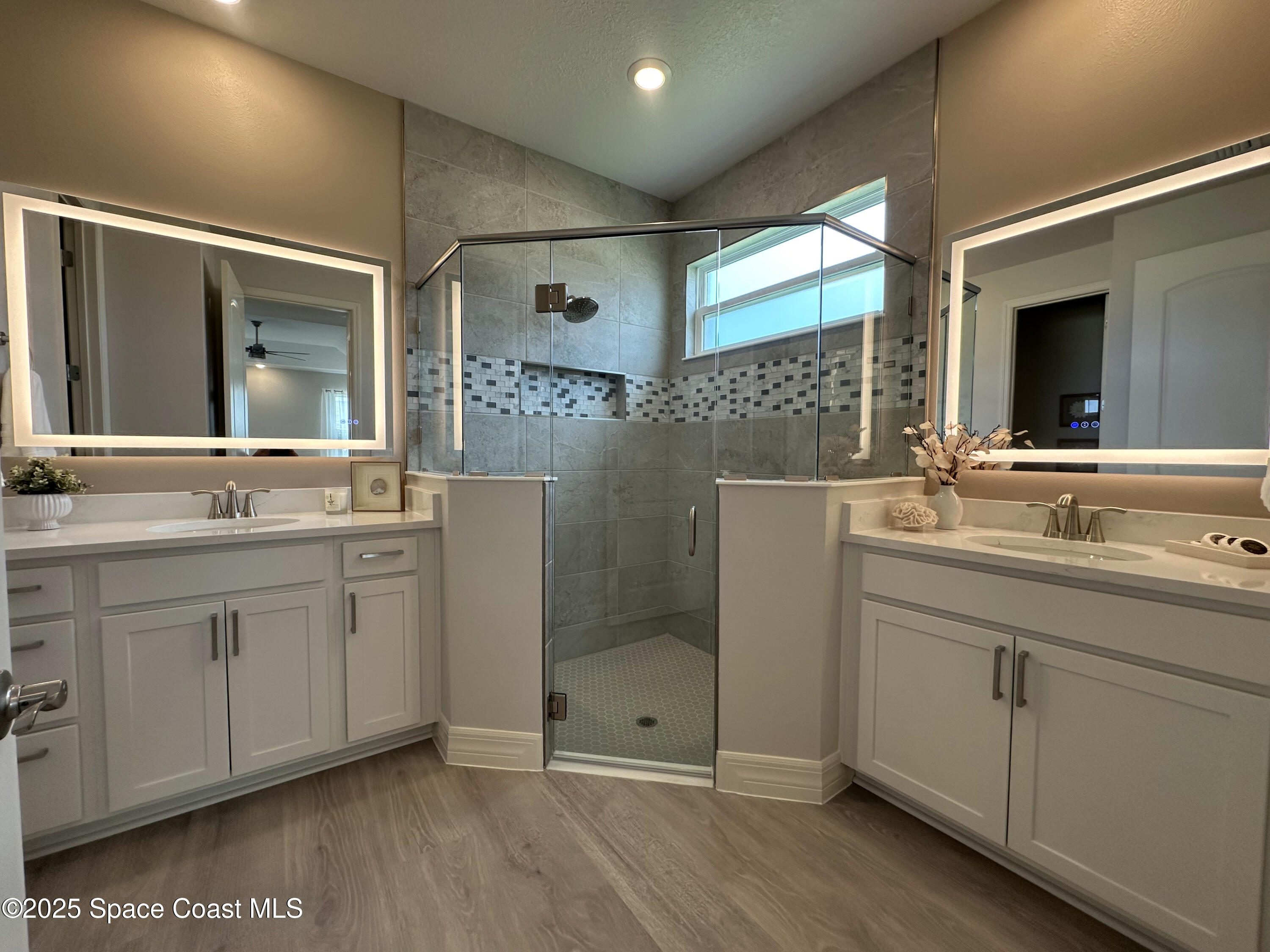 225 1st Street Cocoa, FL 32922 - Photo 25 of 64 a bathroom with double sink and a mirror