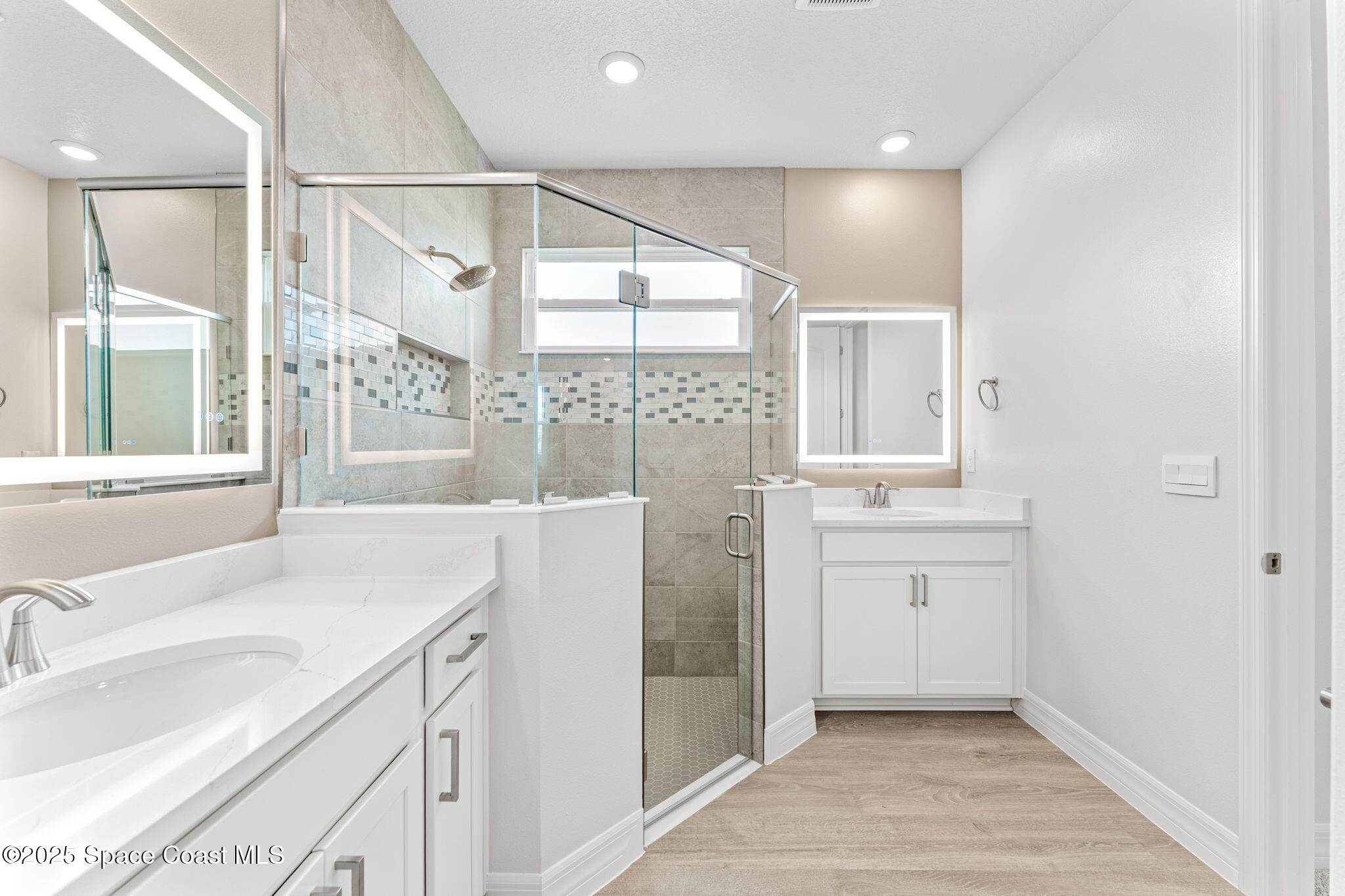 225 1st Street Cocoa, FL 32922 - Photo 31 of 64 a bathroom with a sink and a mirror