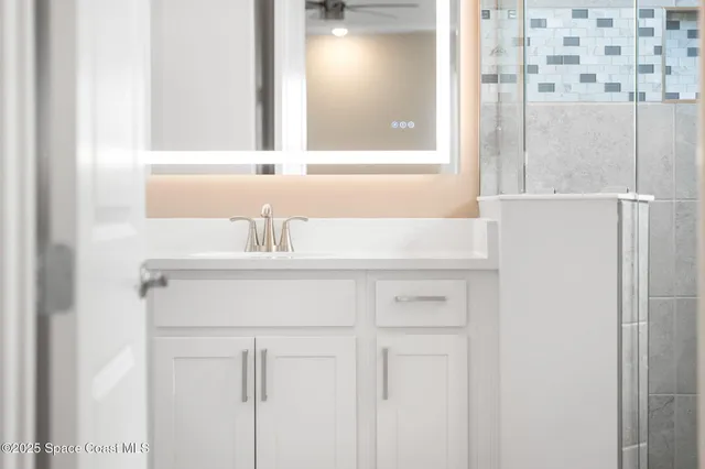 a kitchen with stainless steel appliances granite countertop a stove a sink and a refrigerator with wooden floor