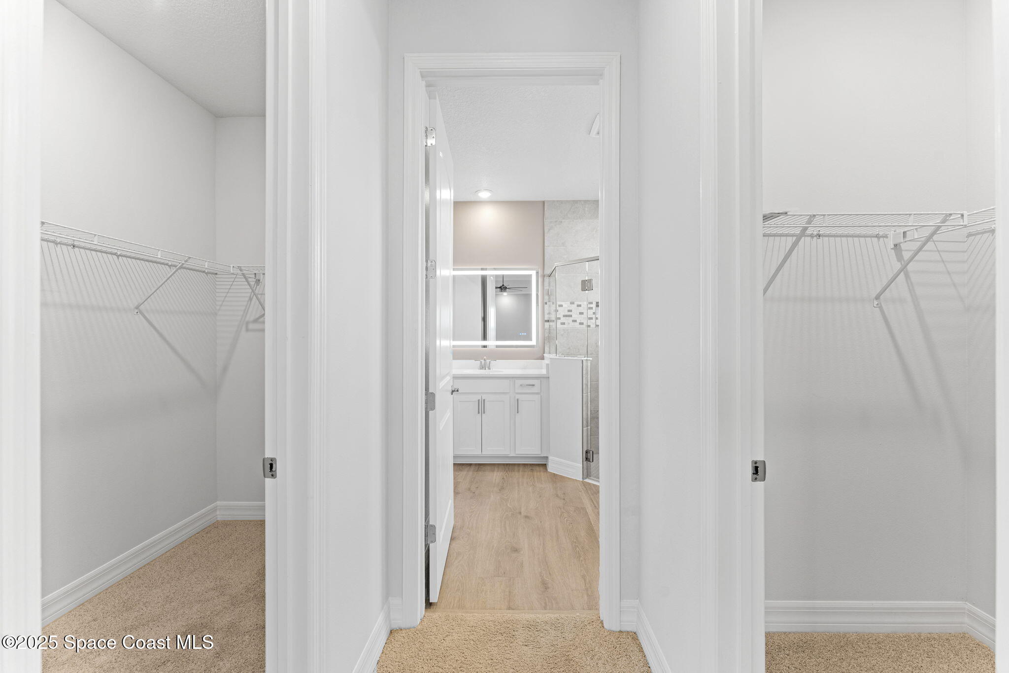 225 1st Street Cocoa, FL 32922 - Photo 34 of 64 a view of a bathroom from the hallway