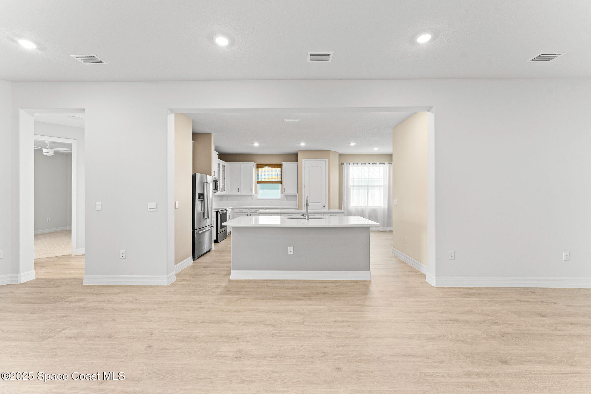 225 1st Street Cocoa, FL 32922 - Photo 49 of 64 a view of kitchen and hall with wooden floor