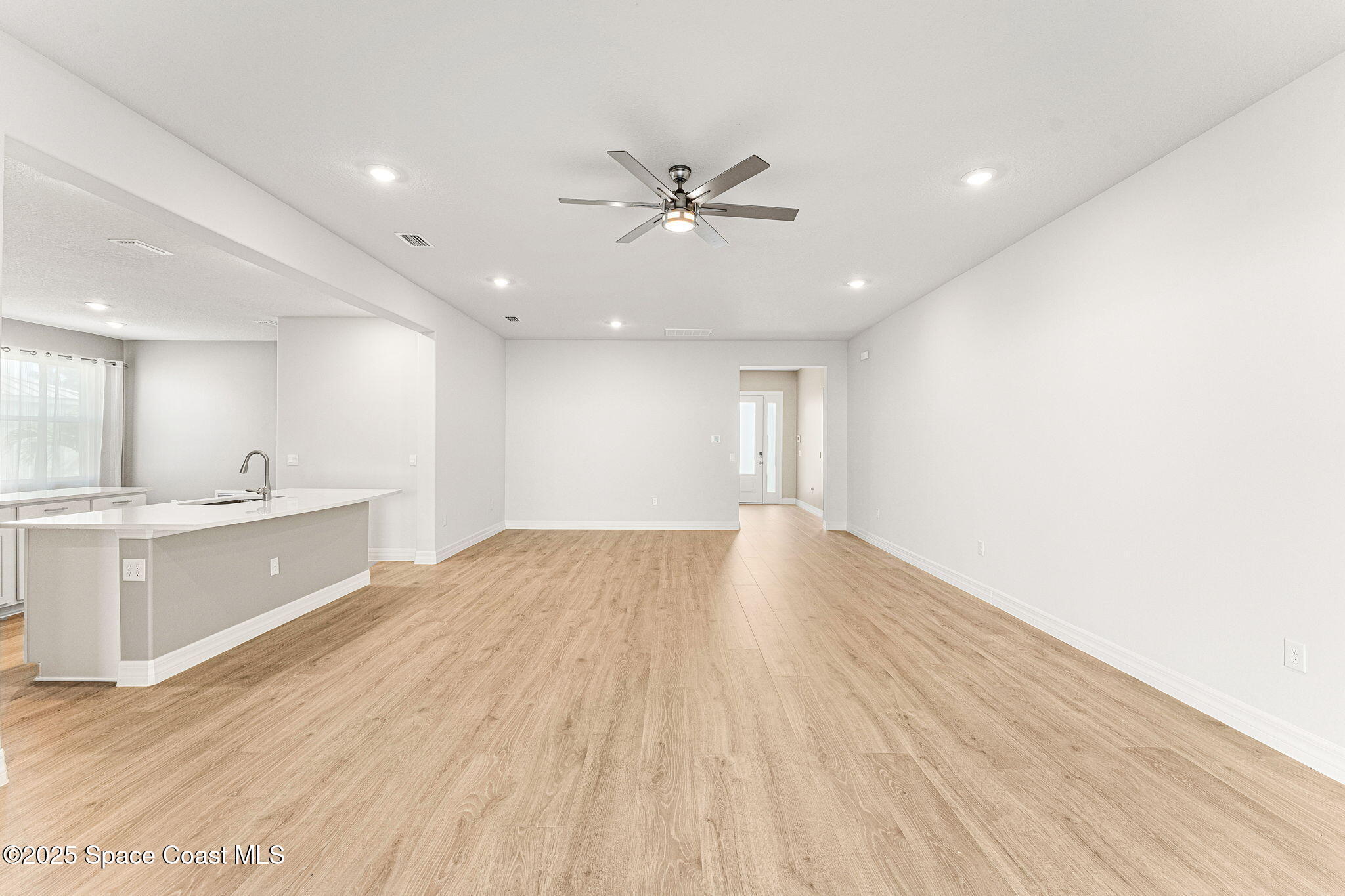 225 1st Street Cocoa, FL 32922 - Photo 51 of 64 a view of an empty room with window and wooden floor