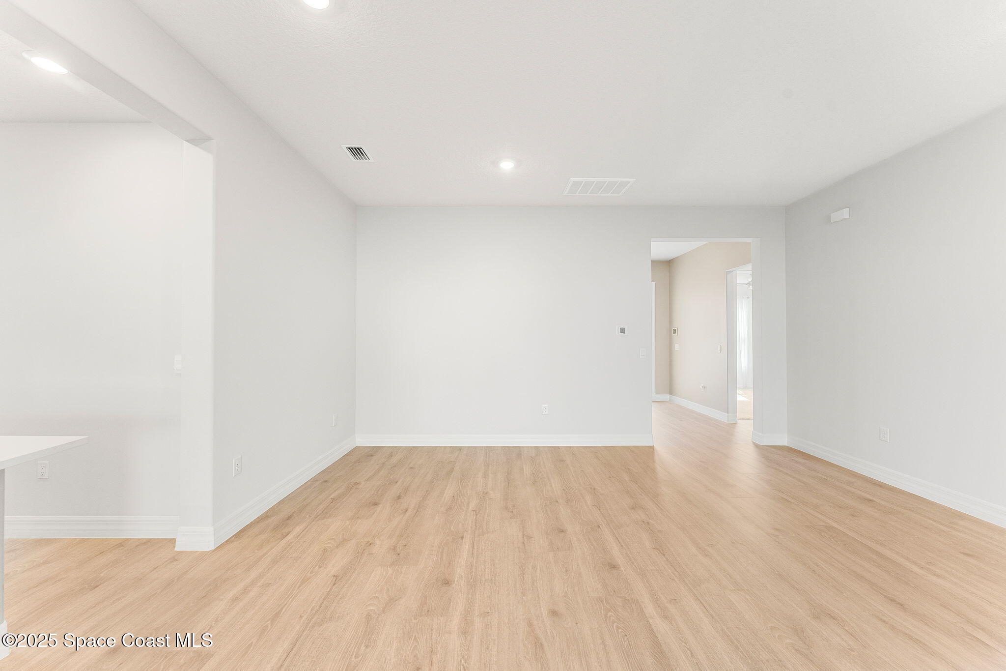 225 1st Street Cocoa, FL 32922 - Photo 53 of 64 a view of an empty room with wooden floor